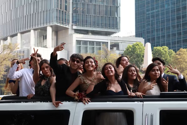 Happy customers enjoying luxury limousine service from logisticsmovehub.pro during a memorable event.
