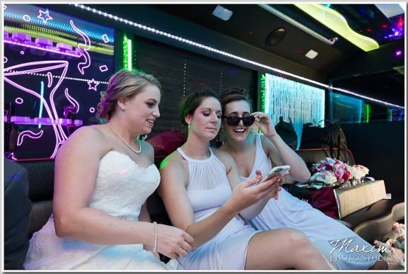 Happy customers enjoying luxury limousine service from logisticsmovehub.pro during a memorable event.